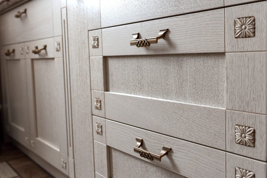 Retro handles metal cabinet in the kitchen